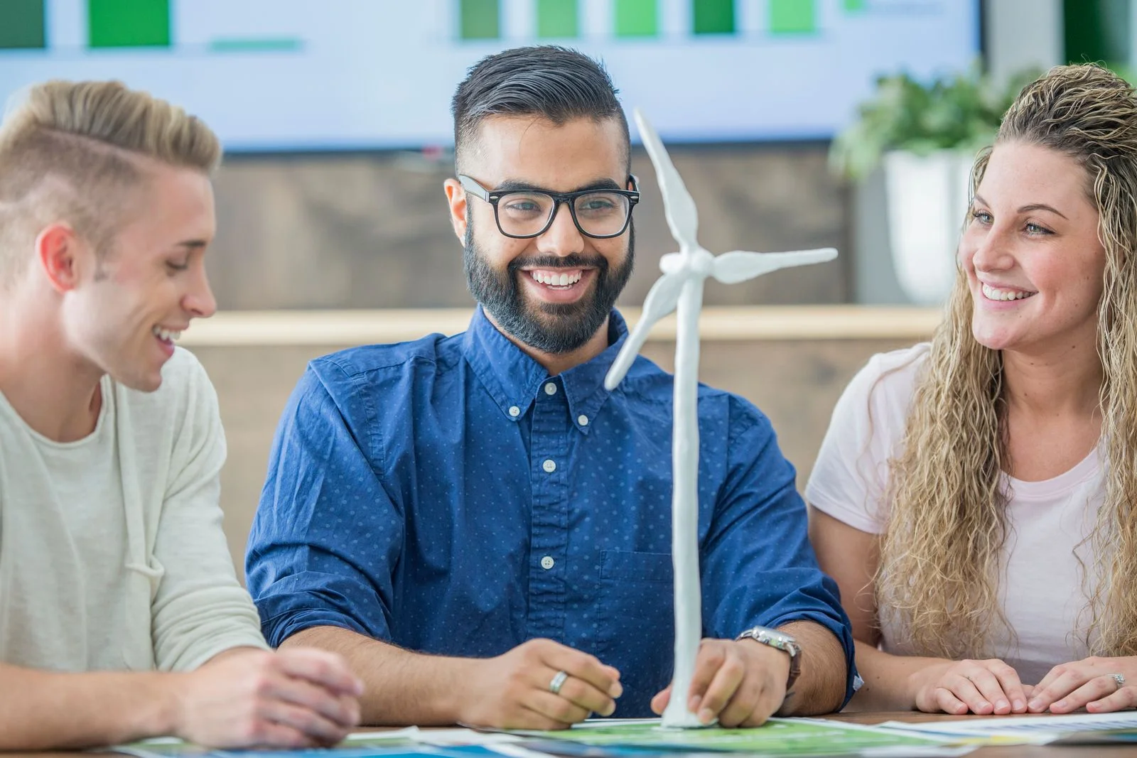 Team in meeting - JConnelly Blog - CSR A New ESG Focus Green Lending for Sustainability