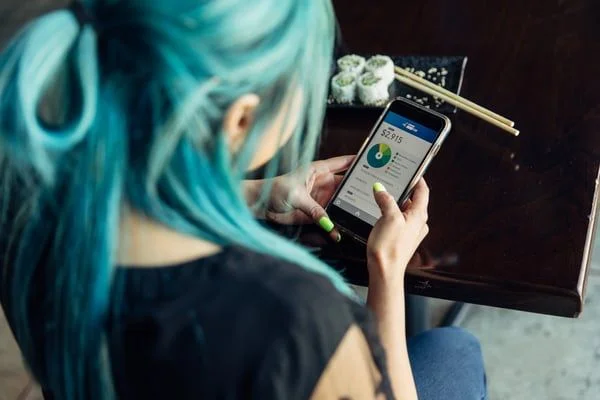 Woman mobile banking- JConnelly blog- PR tips for Financial Brands