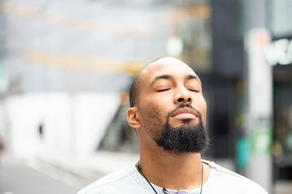 Man with eyes closed- JConnelly Blog- Embracing Positive Storytelling