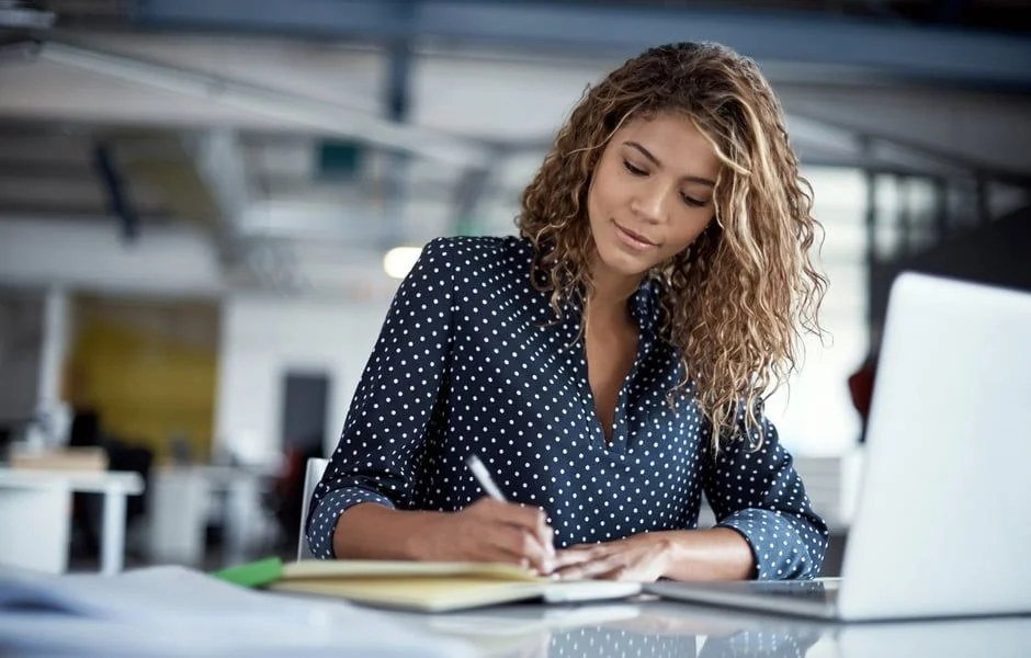 Woman writing- JConnelly gives five tips for crafting a winning pitch