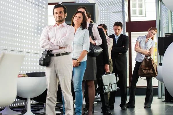 people standing in line waiting for someone - JConnelly Blog