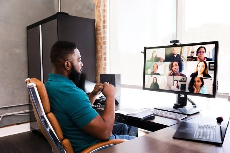 People in an office- JConnelly Blog- How to Communicate Reopening Plans-1