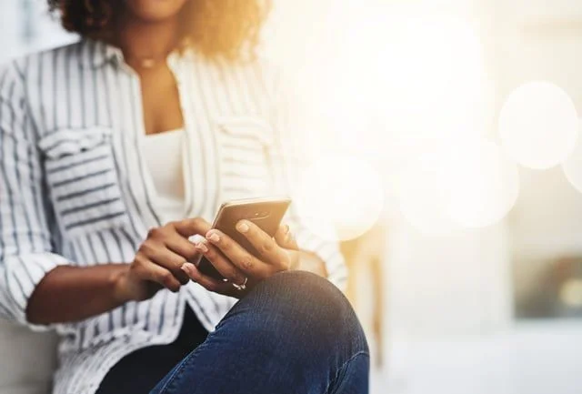 Woman Texting. How to Promote Financial Relationships in a Self-Service Economy- JConnelly blog.jpg