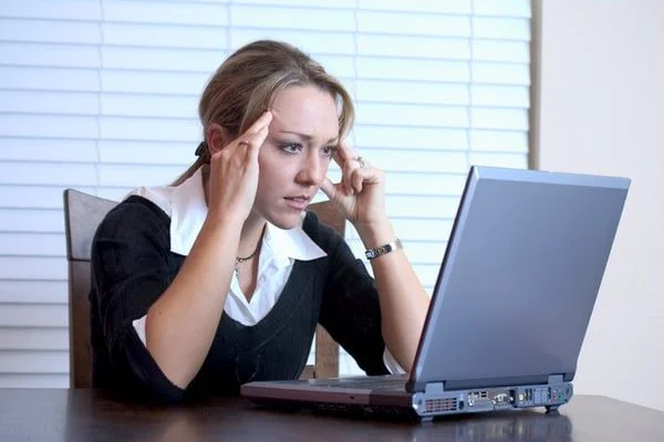 Woman Frustrated at Laptop- JConnelly Blog- How Content Helps Online Reputation