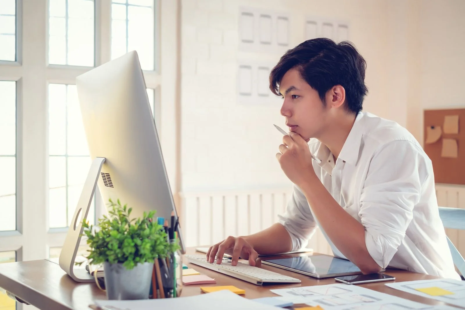 Man on Laptop- JConnelly blog- Tips for Crafting a Memorable Bio