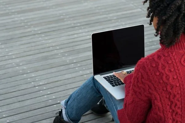 Woman blogging on laptop- JConnelly top 10 blogs of 2018