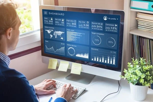 Man looking at computer screen- JConnelly blog- 4 Reasons Why Brand Matters for Asset Managers
