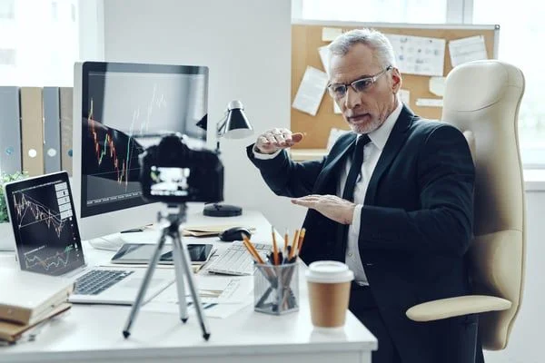 Man filming video- JConnelly Blog- 5 Reasons Why Financial Firms Need Video